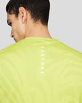 Neon lime Core Tech T-Shirt shown from the back with vertical CASTORE branding down the spine.