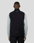 Back view of the Hybrid Gilet on a model, showing reflective detailing on the back over a gray long sleeve