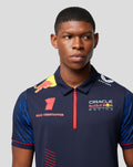 Front view of a navy Max Verstappen polo with a red zipper, Verstappen name on the chest and sponsor logos.
