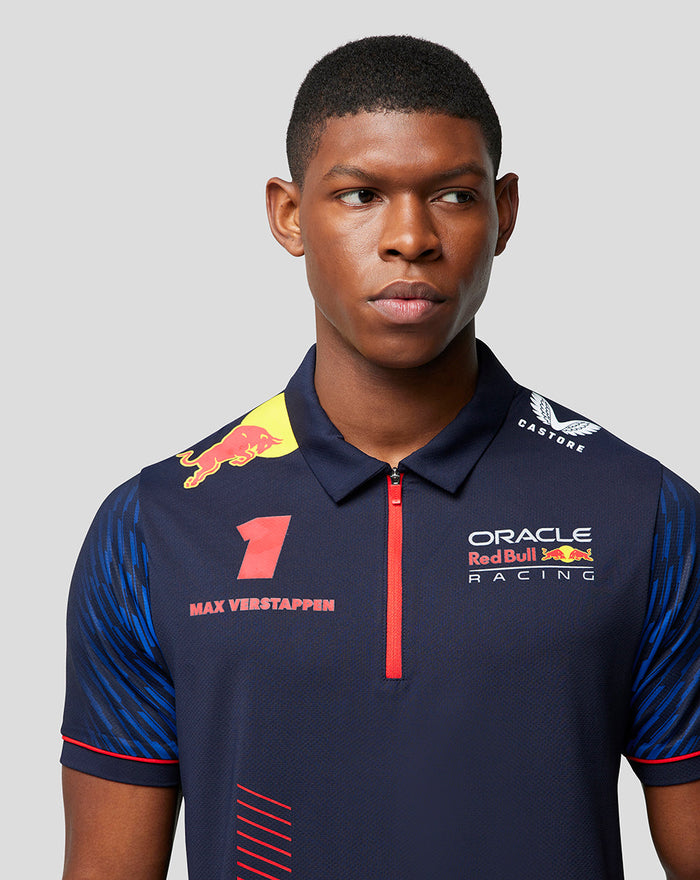 Front view of a navy Max Verstappen polo with a red zipper, Verstappen name on the chest and sponsor logos.