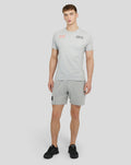 Male model wearing grey marl Red Bull Racing Spielberg short sleeve T shirt with Oracle logo on chest and matching shorts.